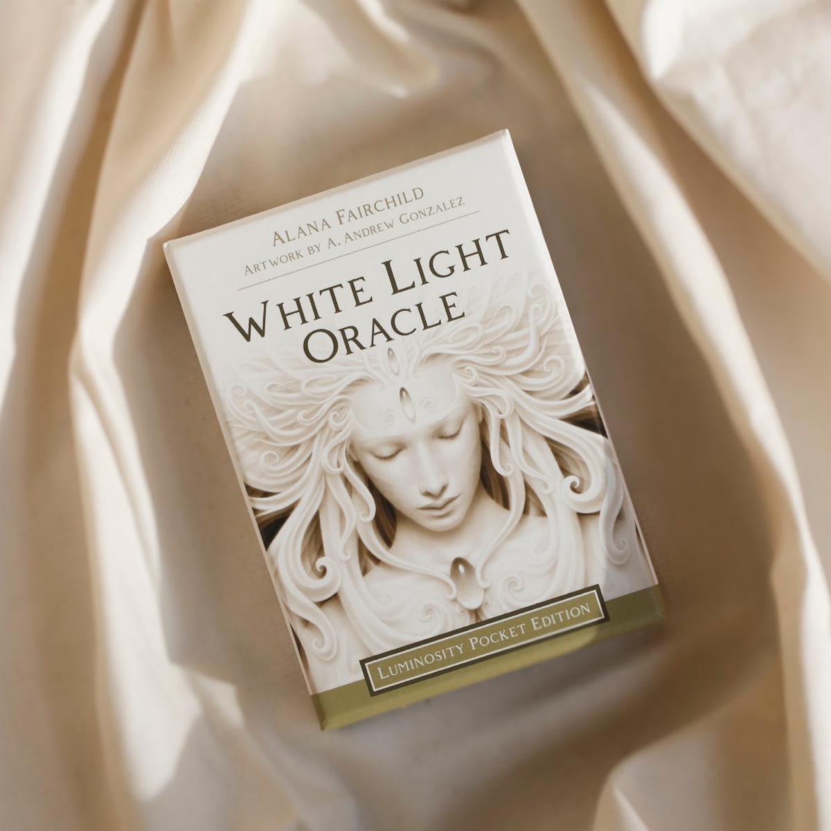oracle deck 'White Light Oracle' by Alana Fairchild on a beige fabric background