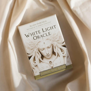 oracle deck 'White Light Oracle' by Alana Fairchild on a beige fabric background
