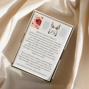 White Light Oracle card set packaging on a beige fabric background