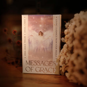 Cardbox titled 'Messages of Grace' with angel imagery on a wooden surface.