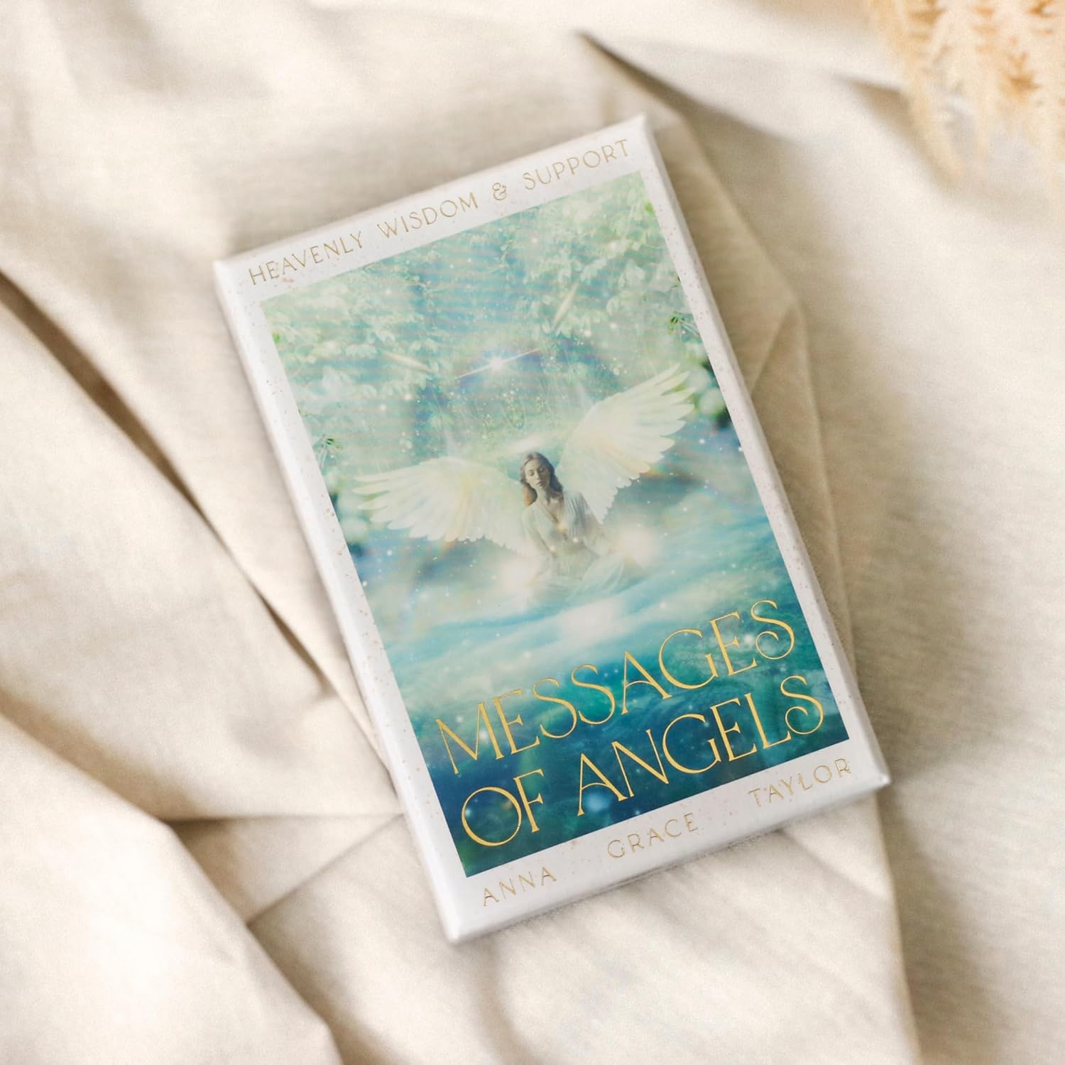 Card deck titled 'Messages of Angels' on a soft beige fabric background