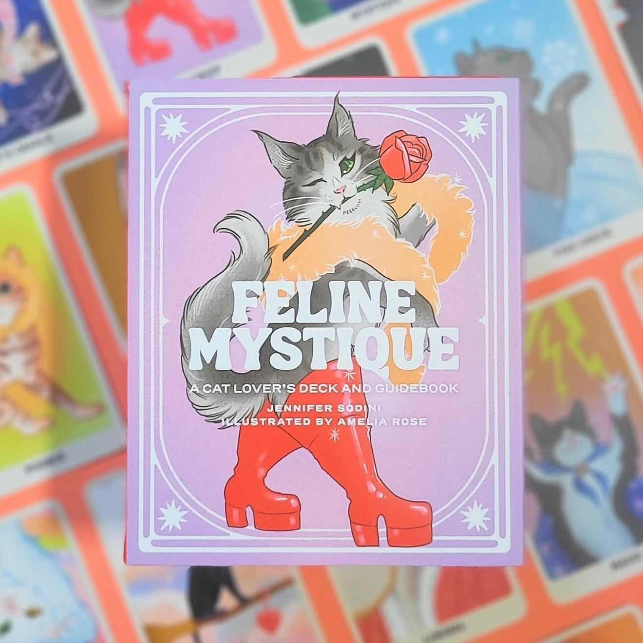 Card deck titled 'Feline Mystique' with a cat illustration on a colorful background.