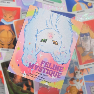 guidebook titled 'Feline Mystique' with a cat illustration on a colorful background