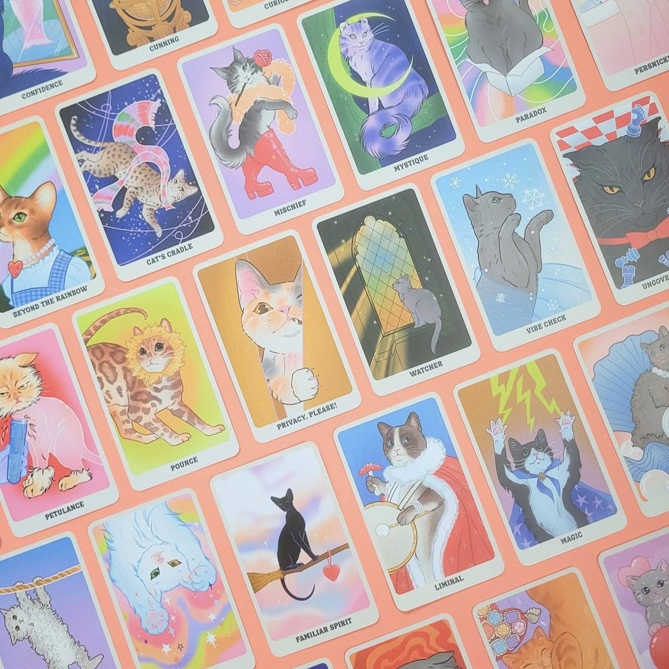 Card deck titled 'Feline Mystique' with a cat illustration on a colorful background.