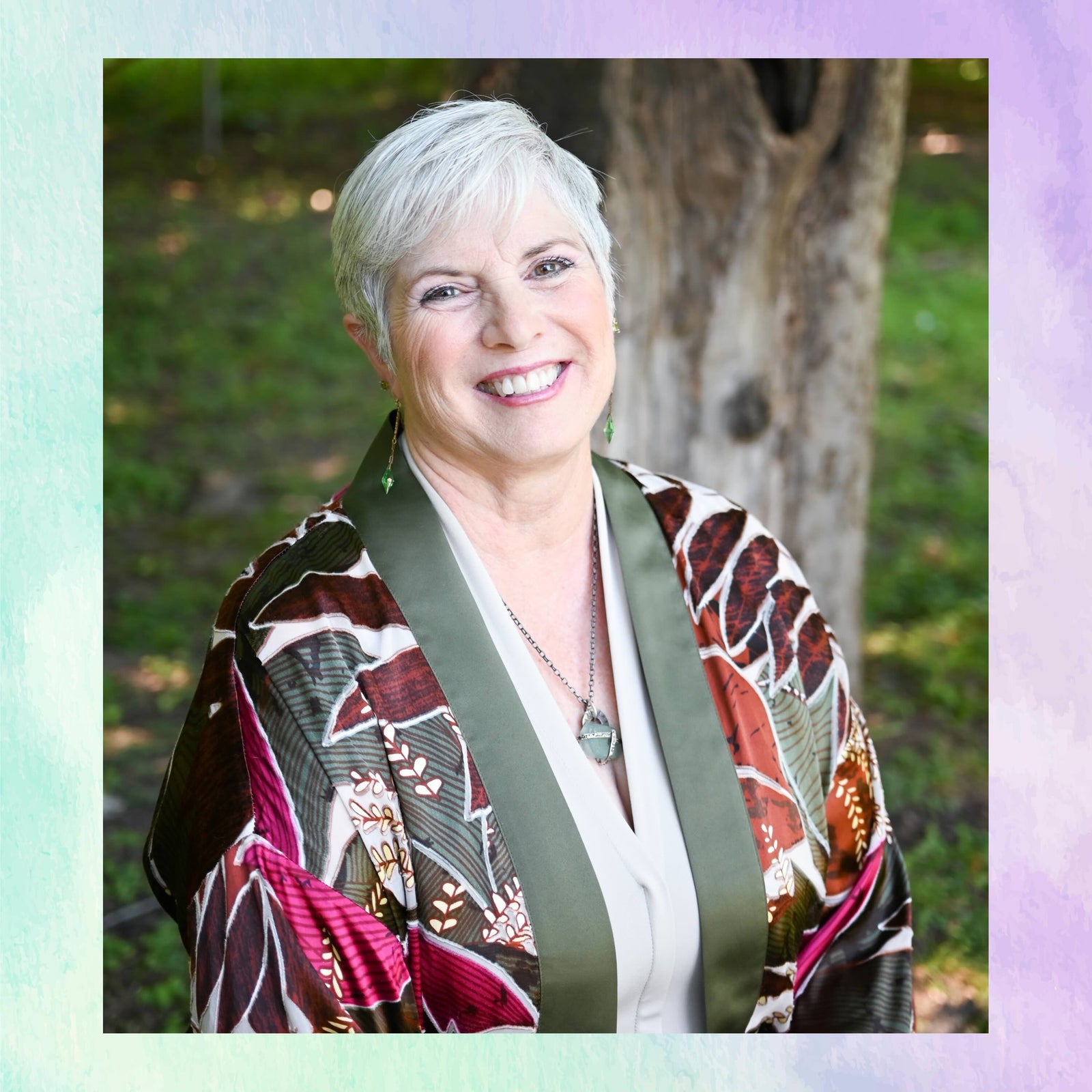 Woman wearing a patterned jacket outdoors with a blurred background
