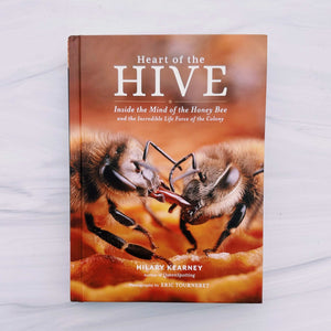 Book titled 'Heart of the Hive' on a light background