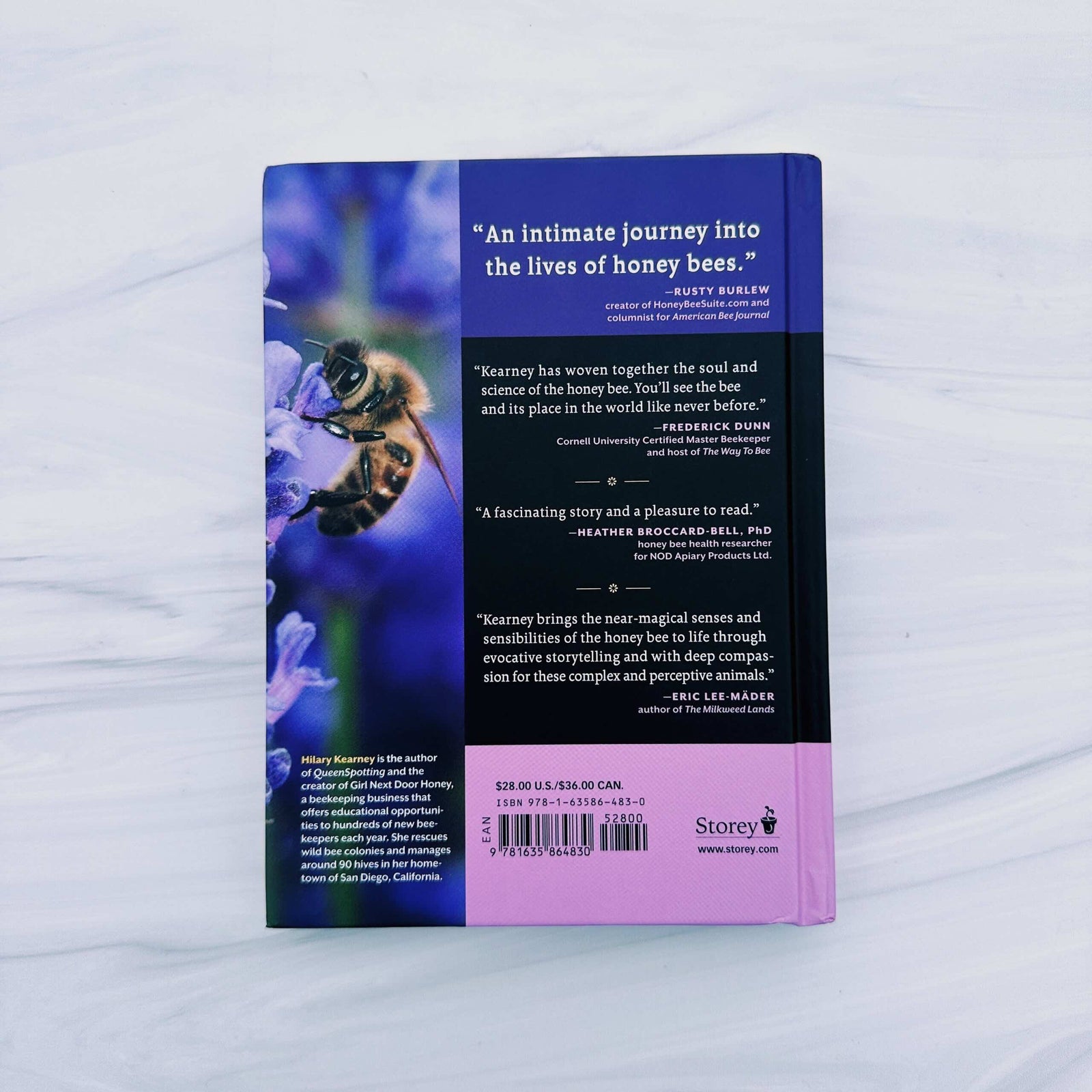 Book titled 'Heart of the Hive' on a light background