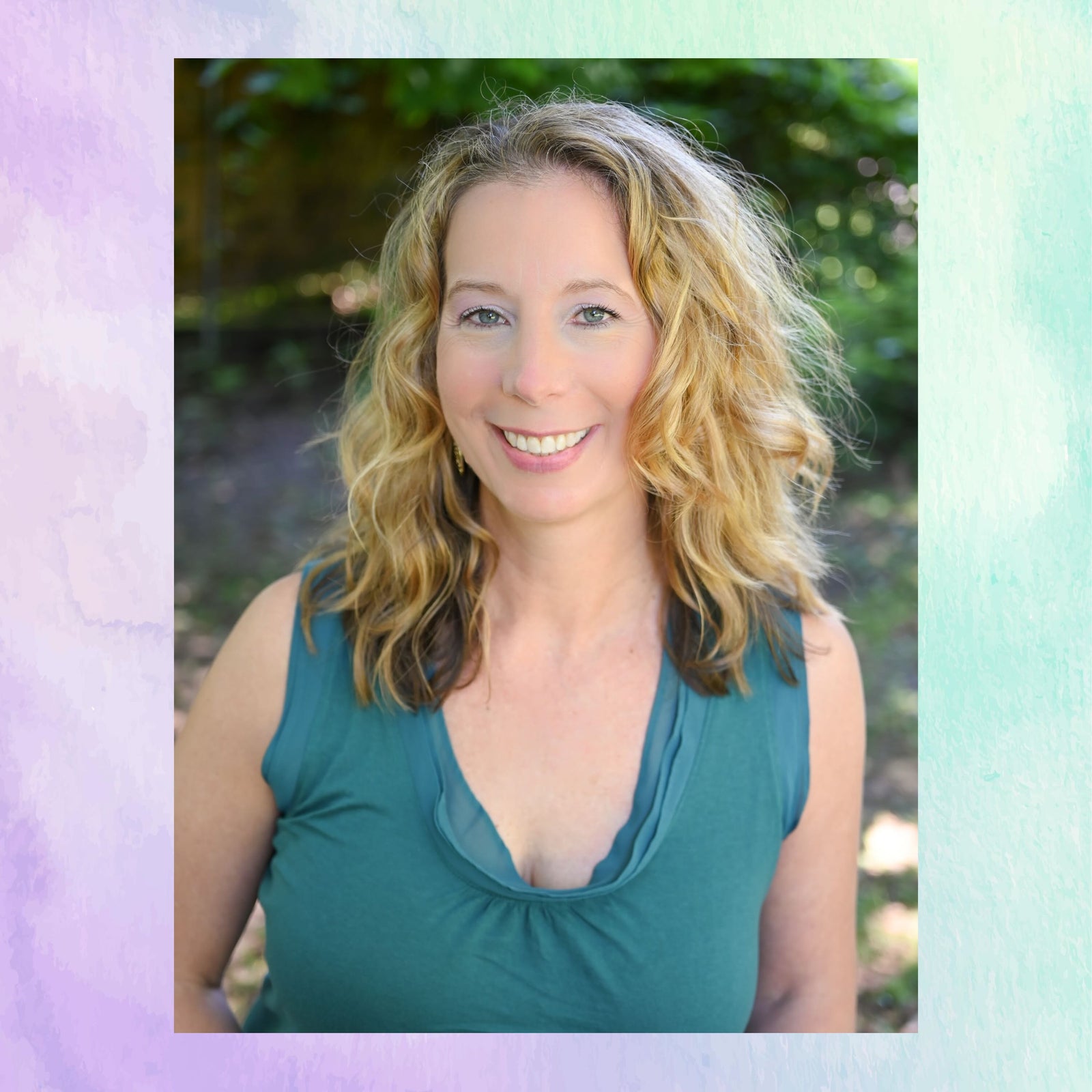 Woman with blonde hair wearing a green sleeveless top outdoors