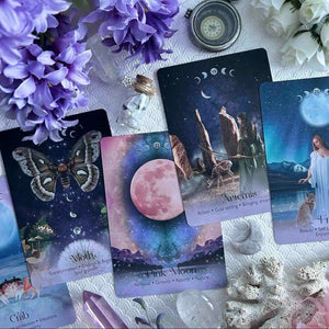 Set of oracle cards with mystical elements on a textured surface