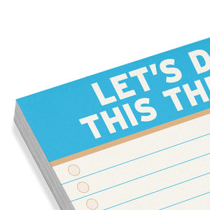 Notebook with blue cover and white text on a white background