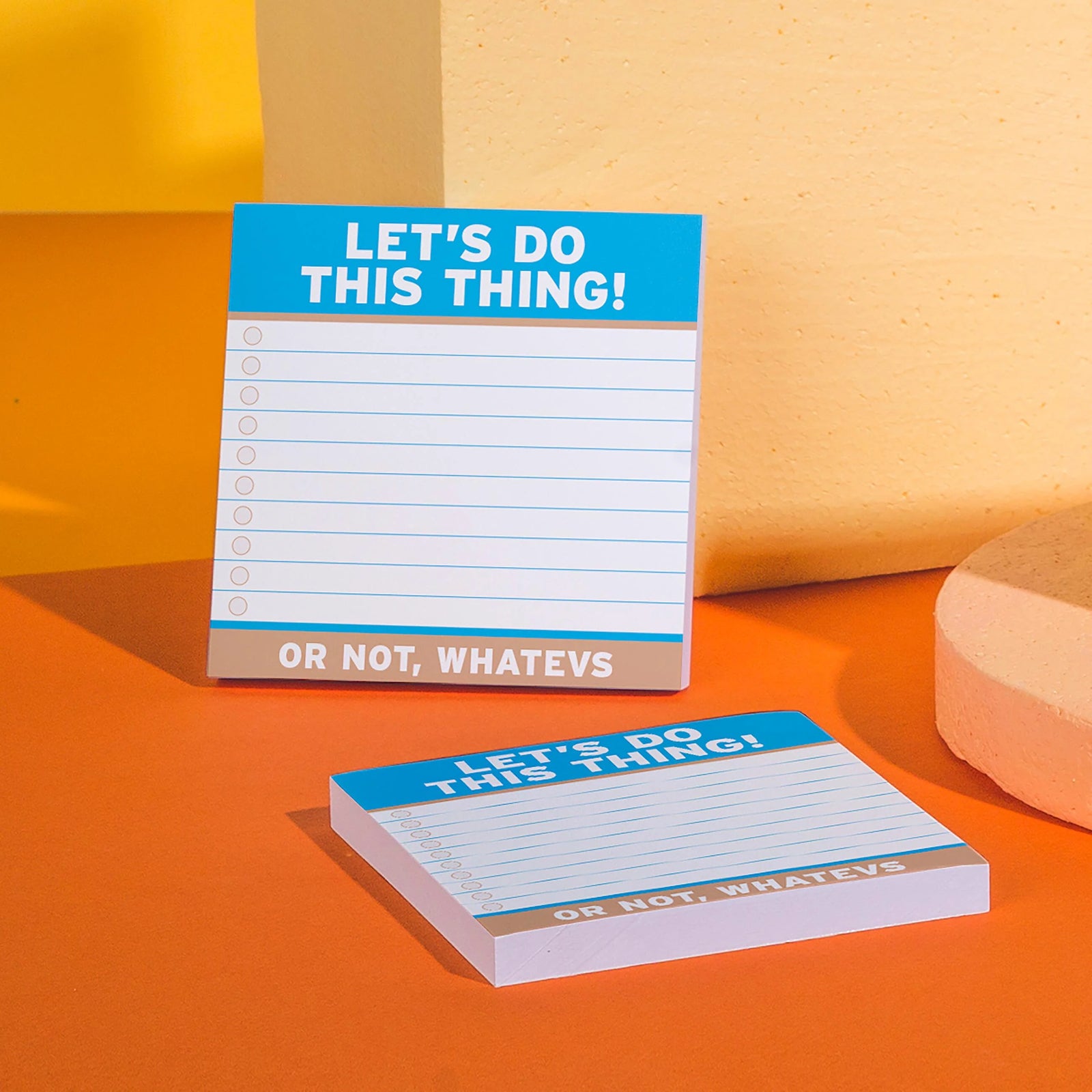Notepad with text 'Let's do this thing! Or not, whatsivs' on a light blue background