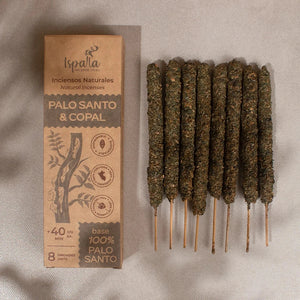 Palo Santo and Copal incense sticks with packaging on a textured surface