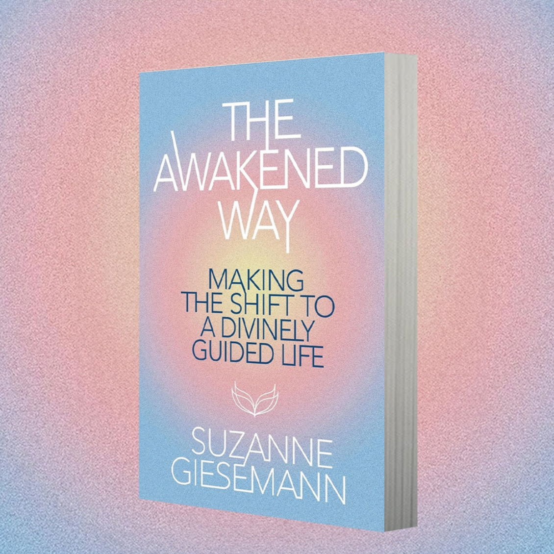 This image features the cover of the book titled "The Awakened Way: Making the Shift to a Divinely Guided Life" by Suzanne Giesemann. The cover design is serene and uplifting, with a soft gradient background transitioning from a pale blue at the top to a gentle pink at the bottom.