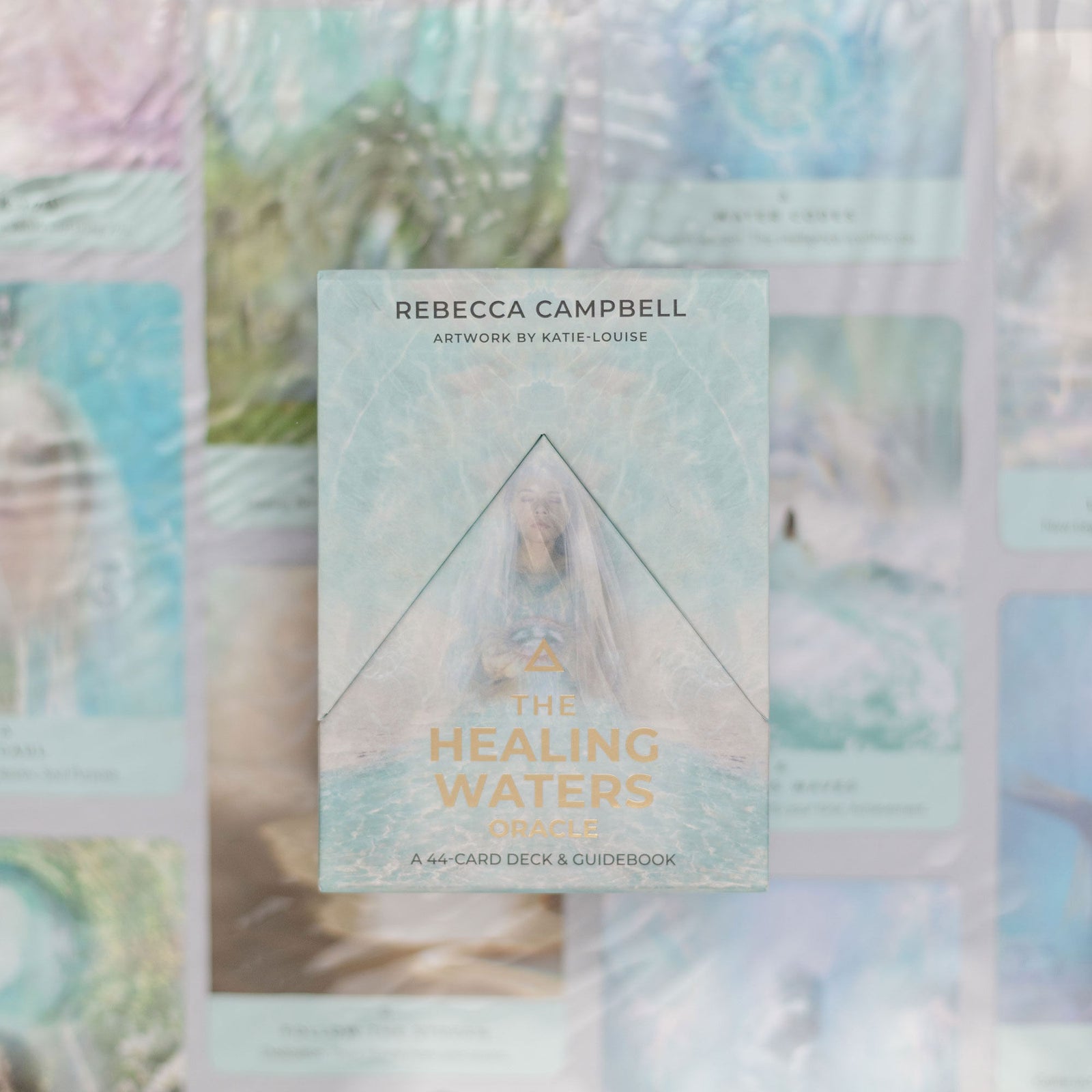 A collection of cards from The Healing Waters Oracle deck, featuring pastel-colored artwork with elements of water and nature.