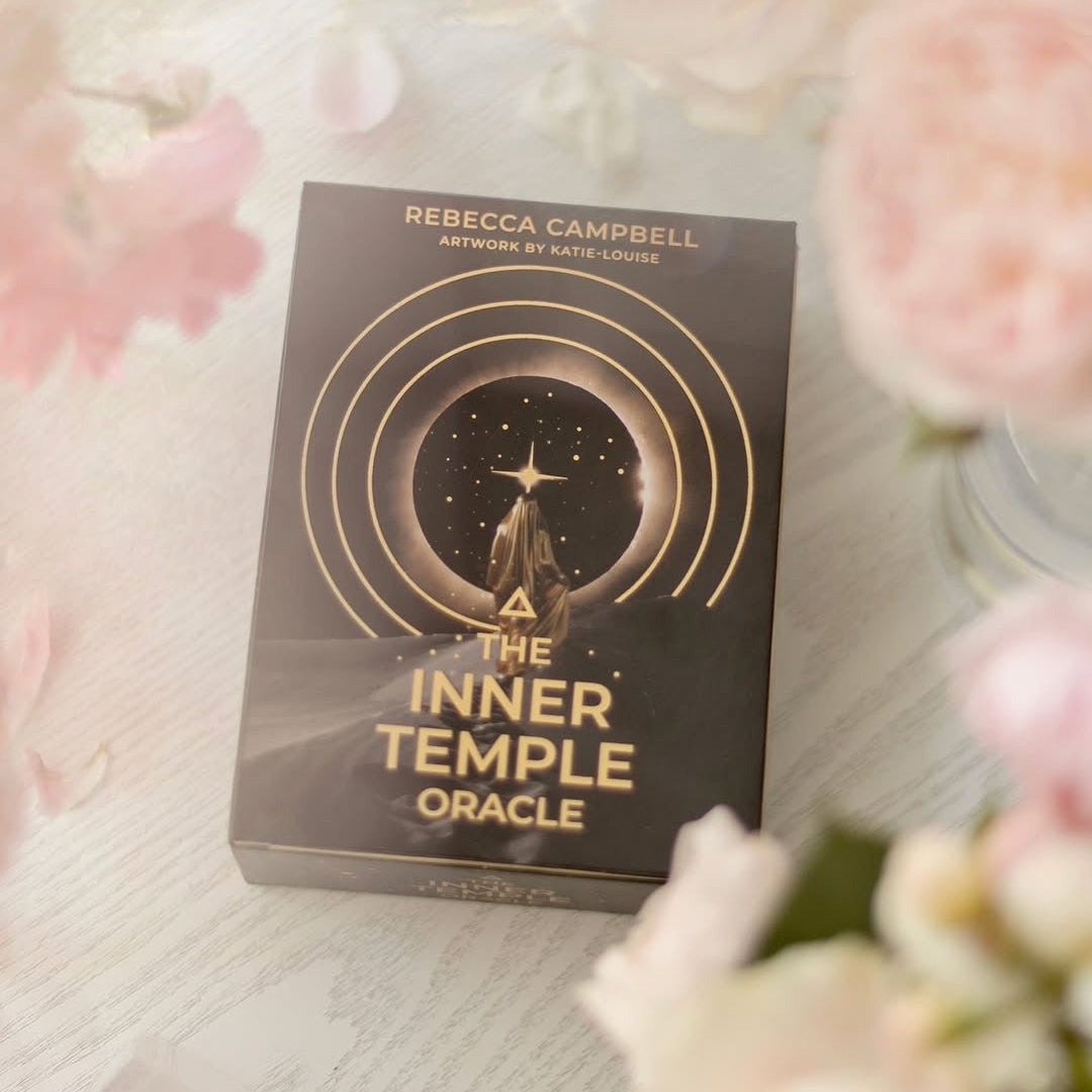 The Inner Temple Oracle card set on a soft, floral background