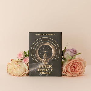Book titled 'The Inner Temple Oracle' by Rebecca Campbell with flowers on a beige background