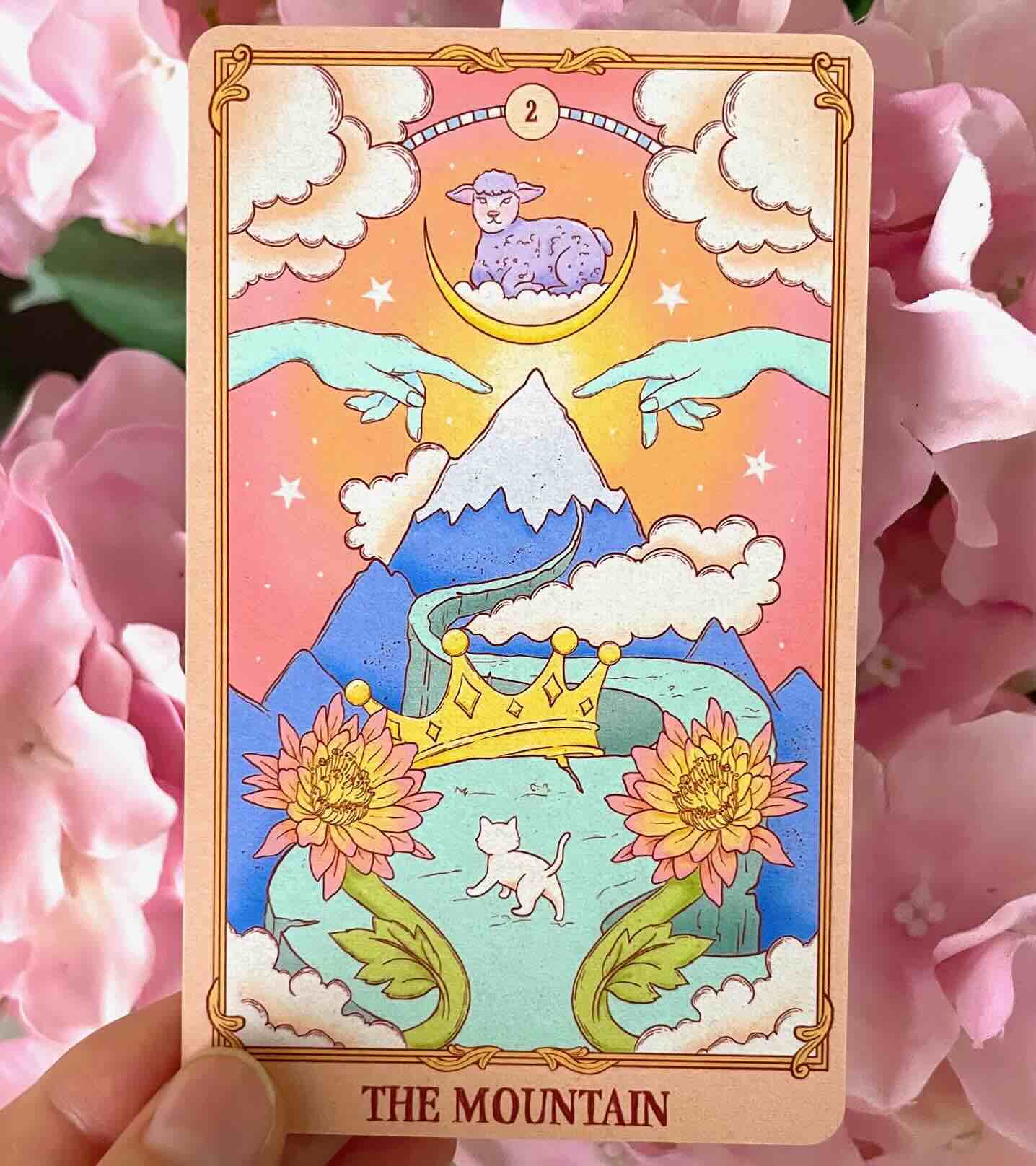 Box of 'Alchemy of the Spirit' Oracle Deck with colorful design featuring animals and nature elements.