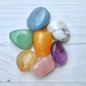 Colorful stones on a light wooden surface
