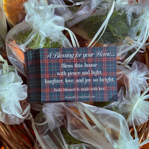 Decorative gift basket with a card reading 'A Blessing for your Home' on a plaid background 