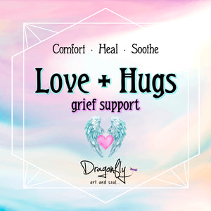 Pastel sky label says 'Love + Hugs – grief support – Comfort · Heal · Soothe' with angel wings and heart, and Dragonfly logo.