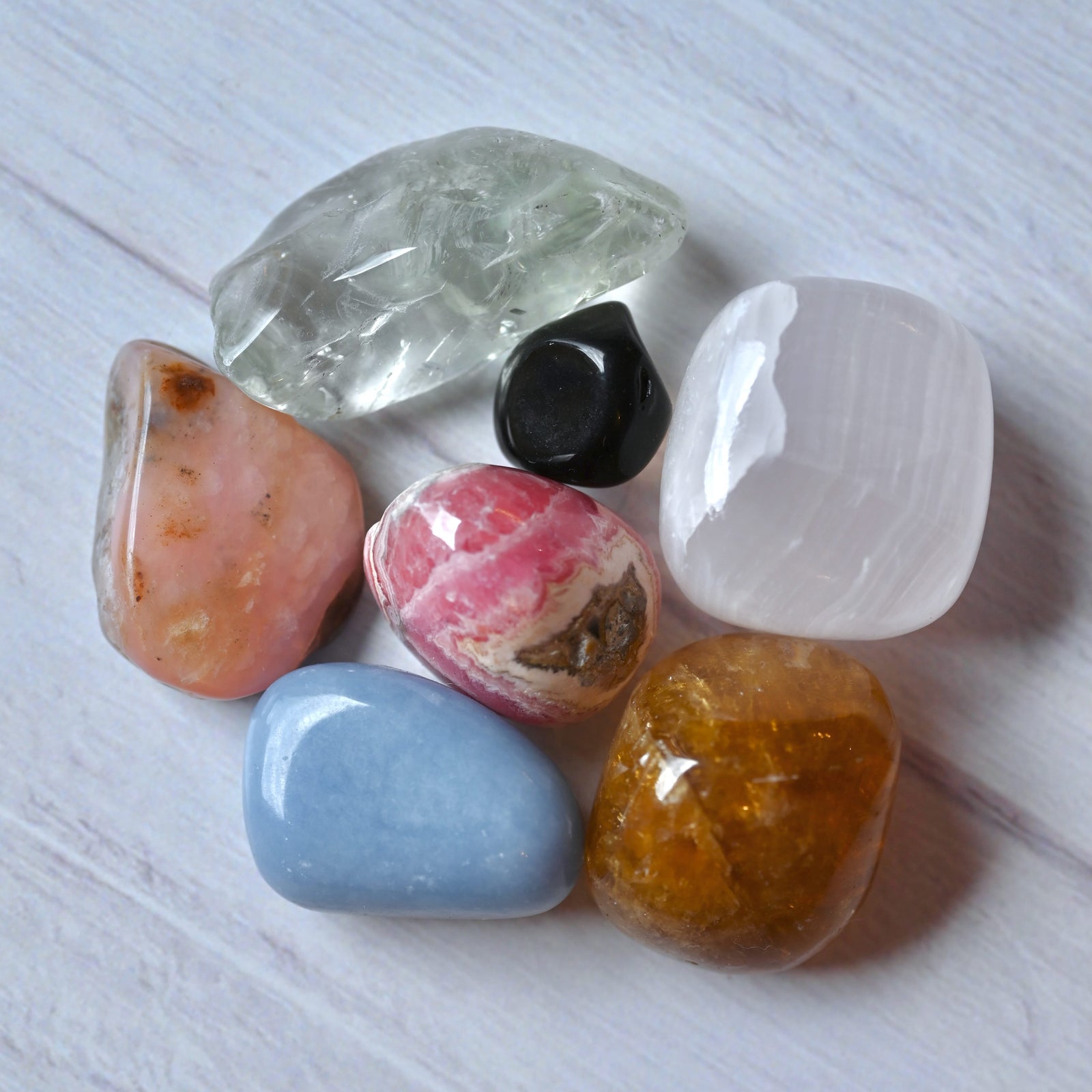 Pastel sky label says 'Love + Hugs – grief support – Comfort · Heal · Soothe' with angel wings and heart, and Dragonfly logo.