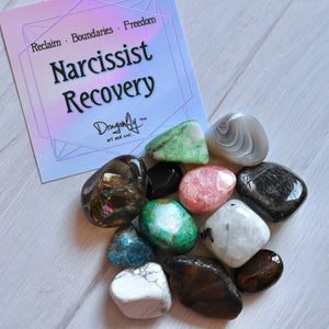 Colorful crystals on a white surface with a 'Narcissist Recovery' card.