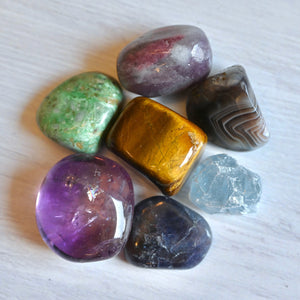 Collection of colorful crystals on a white surface