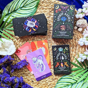 Spirit Allies oracle cards on a woven mat with decorative elements