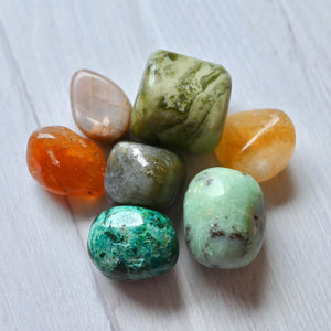 Collection of multicolored stones on a white surface