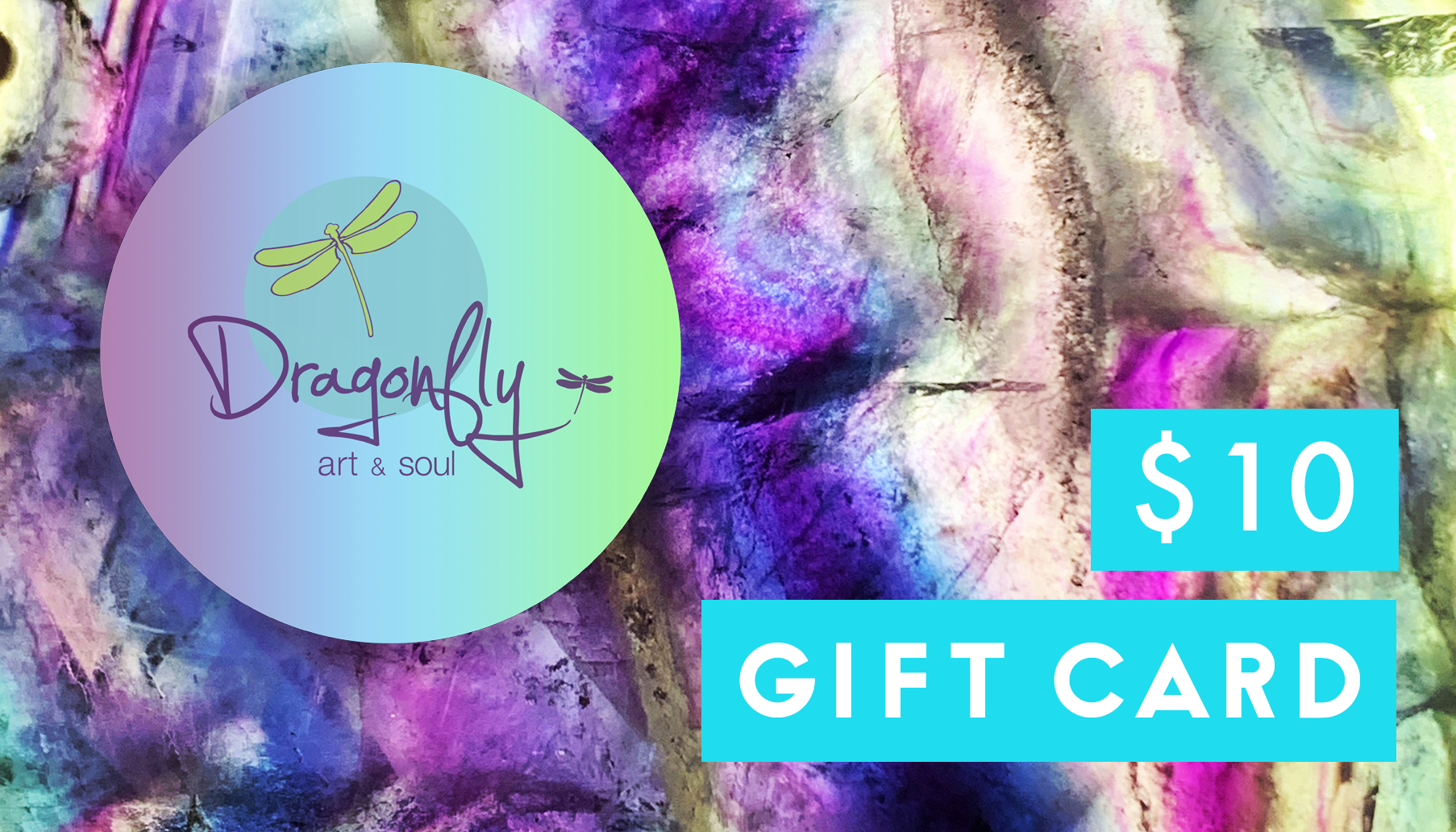 A colorful gift card featuring a textured, abstract background with purple, pink, blue, and white hues. A round logo with a dragonfly and the text "Dragonfly Art & Soul" is on the left. A turquoise box on the right contains "GIFT CARD." Perfect for art lovers in Williamsville NY or as a convenient digital card—Dragonfly Art & Soul Gift Cards.