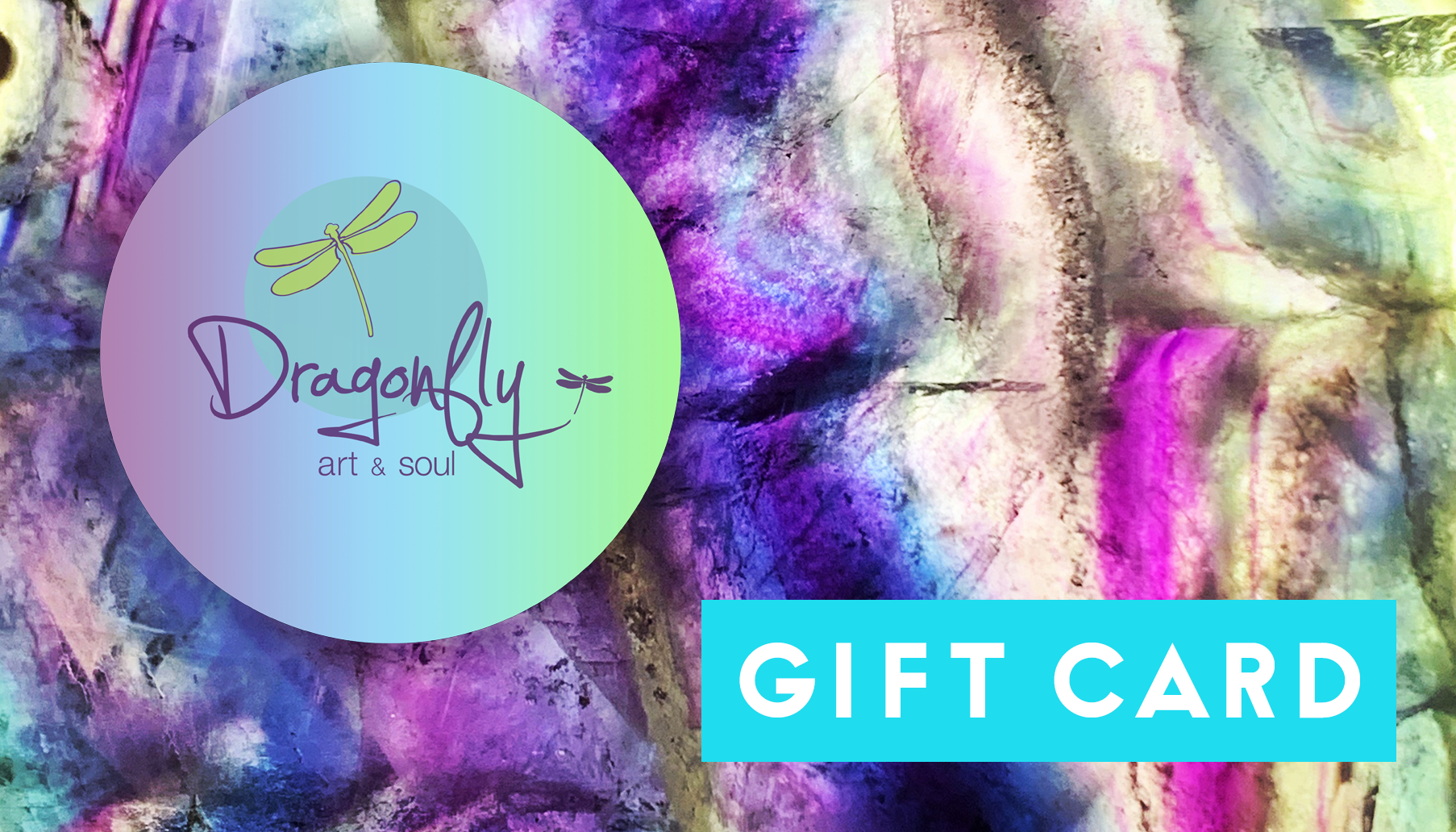 A colorful gift card featuring a textured, abstract background with purple, pink, blue, and white hues. A round logo with a dragonfly and the text "Dragonfly Art & Soul" is on the left. A turquoise box on the right contains "GIFT CARD." Perfect for art lovers in Williamsville NY or as a convenient digital card—Dragonfly Art & Soul Gift Cards.